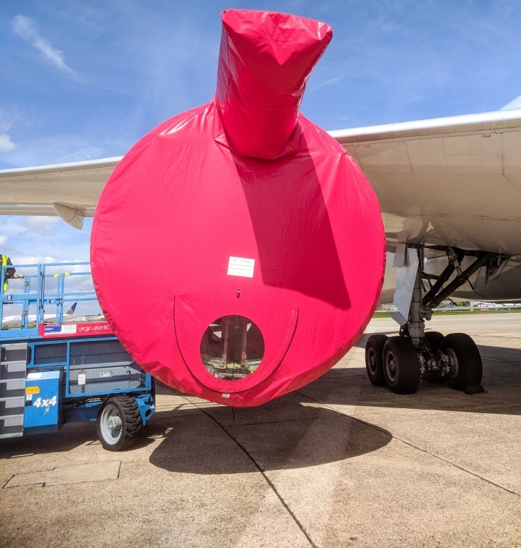 Cunningham Covers Red Engine Intake Cover on Plane